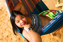 Young Embra Indian girl relaxing in a hammock, Panama, November 2008