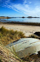 Tender pulled up into the marram grass on Par Beach, St. Martin's, Isles of Scilly. January 2010.