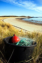 Fishing equipment in marram grass on Par Beach, St. Martin's, Isles of Scilly. January 2010.