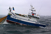 Fishing vessel "Ocean Harvest" hauling net onboard, North Sea, February 2010. Property released.
