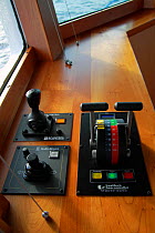Propulsion, steering and bow thruster controls onboard fishing trawler on the North Sea. February 2010, Property released.