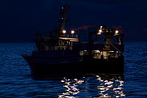 Fishing vessel "Harvester" trawling at twilight on the North Sea. February 2010, Property released.