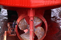 Hull repairs being carried out on a fishing vessel in dry dock, Denmark, March 2010.