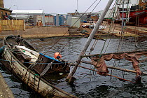 Derelict sunken sailing boat, Skagen harbour, Denmark, March 2010.