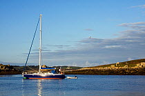 Cruising yacht moored off Lower Town Quay, St. Martin's, Isles of Scilly, UK