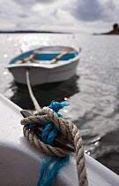 Tender tied to small motorboat off St. Martin's, Isles of Scilly, UK