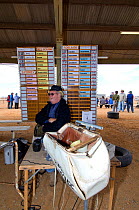 Bookmakers attend to take bets for the Marree Camel Race, one of a number of Australian outback towns on the camel racing circuit. Marree, South Australia , July 2009