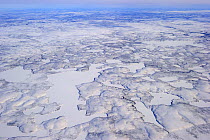 Aerial view of Mackenzie river and delta in winter, North West Territories, Canada April 2010