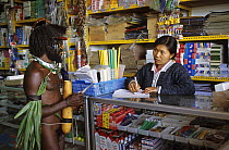 Dani hunter in an Indonesian shop in Wamena, Baliem valley, West Papua, former Irian-Jaya, Indonesia, August 2002 (West Papua).