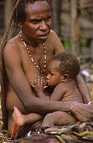 Portrait of Dani woman breast-feeding her baby, Wamena, Baliem valley, West Papua, former Irian-Jaya, Indonesia, August 2002 (West Papua).