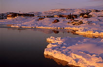 View of Ilulissat from the sea at sunset, Disko bay, Greenland, July 2002
