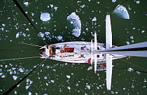 View of sailboat from directly above, showing  deck, and floating ice. King's Bay, Spizbergen, Svalbard Archipelago, Norway, July 2000