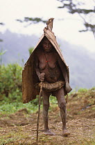 Old Yali woman wearing rain protection made of bark. West Papua, former Irian-Jaya, Indonesia, August 2002 (West Papua).