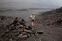 Hiker on the Kilauea Iki Crater trail, Hawai'i Volcanoes National Park. The Big Island of Hawaii, USA, December 2008, model released
