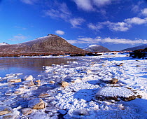 Lough Shannagh with light covering of snow on the beach and Doan peak in the background, Mourne Mountains, County Down, Northern Ireland, UK