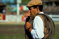 A gaucho (cowboy) waits with his lasso during the rodeo of Fiesta De La Patria Gaucha, Tacuarembo, Uruguay, April 2008