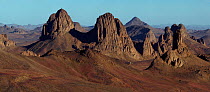 Volcanic plugs at Assekrem, Algeria. These plugs (formed by erosion of the soft volcanic rock surrounding them) are found in the centre of the Hoggar massif in Algeria, three high tops dominate the re...