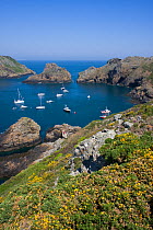 Boats moored in the natural harbour of Harve Gosselin, Sark, Channel Isles, UK, Summer 2009