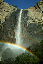 Sunlight creating a rainbow in the spray of the Bridalveil Falls, Yosemite National Park, California, USA, June 2008