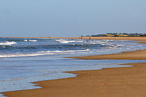 Holkham Beach with walkers in the far distance, Norfolk, England, UK, November 2009