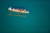 Aerial view of typical malagassy outrigger boat filled with people in Morondava, West Madagascar. November 2008