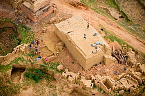 Aerial view of people working at a traditional brick factory, near Tana, Madagascar, Africa. November 2008