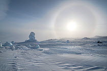 Sundog / Parhelion (circle of light around the sun) with large ice fumerole in distance,  Mt Erebus, Antarctica, November 2008