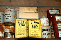 Food supplies (powdered egg and golden syrup) in interior of Shackleton's Nimrod Hut, frozen in time from the British Antarctic Expedition 1907, Cape Royds, McMurdo Sound, Antarctica, November 2008
