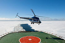 Helicopter landing on the deck of the Russian ice breaker ship, Kapitan Khlebnikov, Ross Sea, Antarctica, November 2008