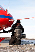 Aerial photography Cineflex camera attached to helicopter, BBC film crew, McMurdo Sound, Antarctica, November 2008