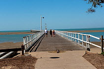 People walking along the Hervey Bay Jetty in the Great Sandy Strait Marine Park. Queensland, Australia October 2009