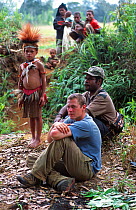Researcher Jeff Wilson with Huli people in Papua New Guinea during the filming of 'Jungles' for the BBC NHU Planet Earth series. August 2004.