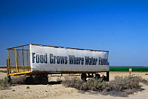 Large sign on Interstate 5 in California's Central Valley agricultural region, reminding the public that much of California would be a desert or semi-desert, incapable of growing crops to feed America...