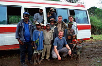 BBC Producer, Huw Cordey, and cameramen, Paul Stewart and Tom Clarke, with Huli people, Tari Valley, Papua New Guinea during filming of BBC series Planet Earth, August 2004.