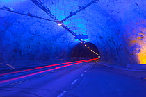 Light trails from a passing vehicle in the Laerdalstunnelen road tunnel, the longest of its type in the world. Norway, Europe. June 2009