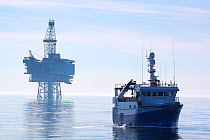 Fishing vessel "Harvester" and the "Jotun B" oil production platform. North Sea, May 2010.