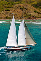 Schooner "Windrose" sailing close to the coast at the Panerai Antigua Classic Yacht Regatta, Caribbean, April 2010.