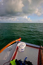 Toilet bucket on the trampoline of 30ft Tiki catamaran "Abaco". Exumas, Bahamas, Caribbean. June 2009, property released.