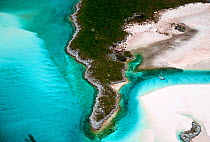 Aerial view of lone yacht anchored in the Exumas. Bahamas, Caribbean, June 2009.