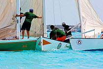 Clash between boats during the Bahamian Sloop regatta, Georgetown, Exumas, Bahamas. April 2009.