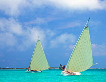 Two boats racing in the Bahamian Sloop regatta, Georgetown, Exumas, Bahamas. April 2009.