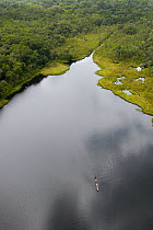Aerial view of Ox-bow lake with dugout canoe, Yasuni National Park Biosphere Reserve Amazon Rain Forest. Ecuador South America. November 2004