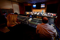 Dubbing theatre at Angel Studios, with composer George Fenton, working on the score for BBC series 'Life'. England, UK, September 2009