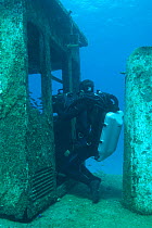 Cameraman Mike Pitts filming underwater for the BBC series 'Life' in a sunken tug boat, off the coast of the Bahamas, Caribbean, February 2007