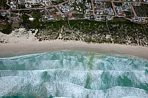 Aerial view houses, beach and surf, Cape Agulhas, South Africa, August  2009