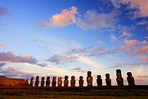 Silhouette of giant moai statues in Ahu Tongariki with Poike Peninsula in the background, Easter Island, Pacific ocean, November 2004