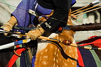Details of costume of a traditionally dressed samurai (warrior) from the Takeda School of Horseback Archery with bows and arrows, during a Yabusame (Japanese mounted archery), at Meiji Jingu Shrine, T...