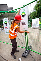 Greenpeace protesters closing down forcourt of BP petrol station, in response to the oil-spill disaster in the Gulf of Mexico. Central London, UK, 27 July 2010