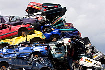 Pile of scrap cars prior to being recycled. England, UK July 2009