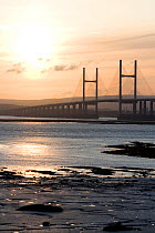 Sunset at second Severn Bridge crossing, looking west from Severnside, Avon. The Severn Estuary could be threatened by proposed tidal barrage. Gloucestershire, England, UK April 2010